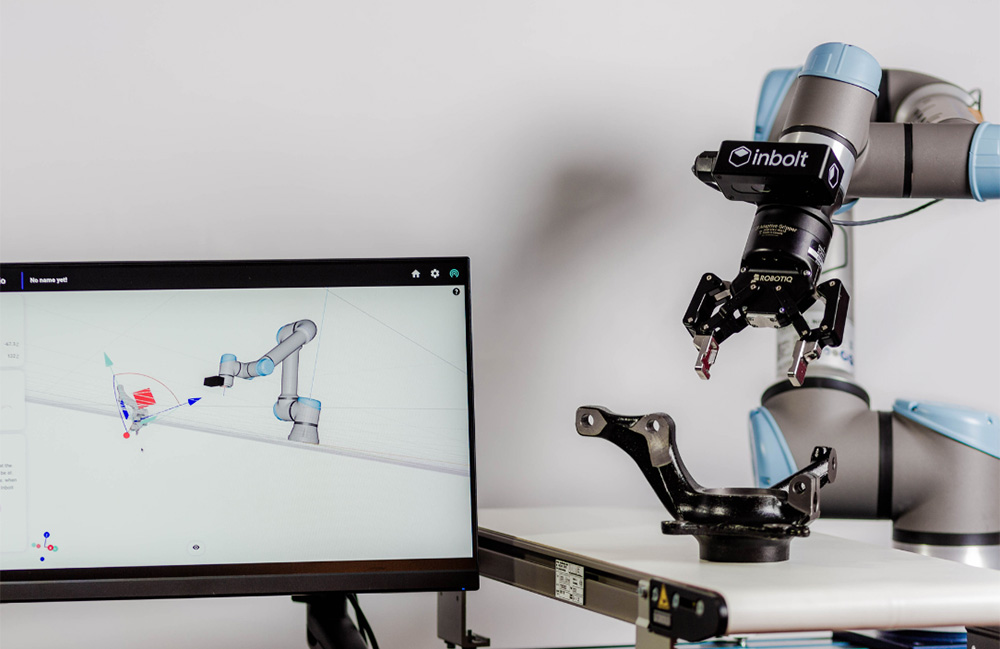 A UR cobot arm with Inbolt's technology attached. 